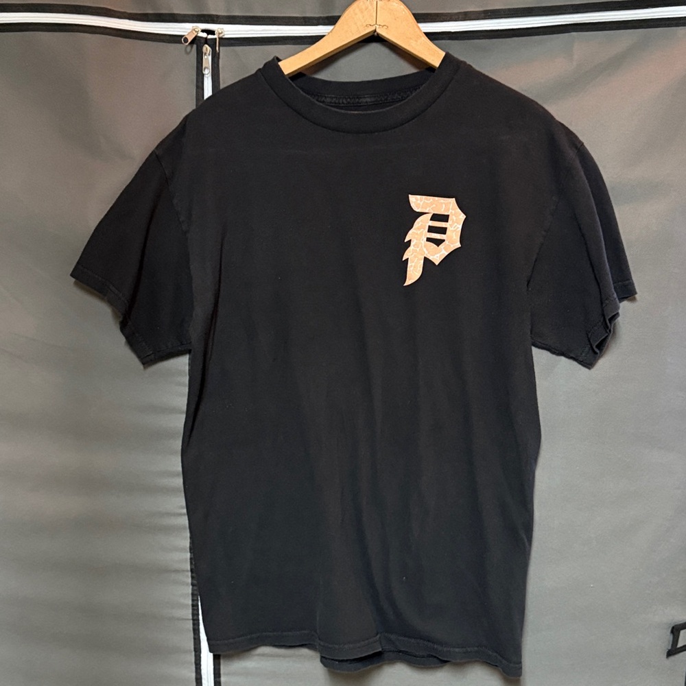 Primitive Black Tee with Peach Logo and Graphic on Back